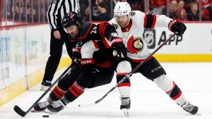 Carolina Hurricanes' William Carrier (28) protects the puck from Ottawa Senators' Nick Jensen (3) during the second period of an NHL hockey game in Raleigh, N.C., Saturday, Nov. 16, 2024. (Karl B DeBlaker/AP)