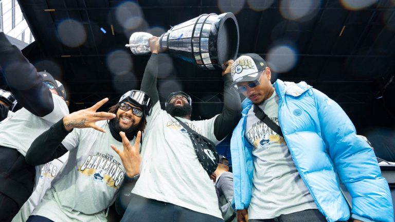 Toronto Argonauts players spray champagne during a Grey Cup championship rally in Toronto on Tuesday, Nov. 19, 2024. The Argonauts defeated the Winnipeg Blue Bombers on Sunday to win the cup. (Arlyn McAdorey/CP Photo)