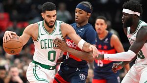 Boston Celtics forward Jayson Tatum (0) collides with Washington Wizards guard Bilal Coulibaly, center during the first half of an NBA basketball game Friday, Nov. 22, 2024, in Washington. (John McDonnell/AP)