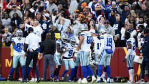 Dallas Cowboys wide receiver KaVontae Turpin (9) celebrates with teammates after scoring a 99-yard touchdown off a kickoff return during the second half of an NFL football game against the Washington Commanders. (Nick Wass/AP)