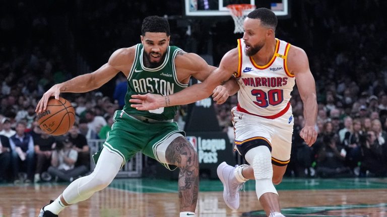 Boston Celtics forward Jayson Tatum, left, drives to the basket against Golden State Warriors guard Stephen Curry during the second half of an NBA basketball game, Wednesday, Nov. 6, 2024, in Boston. (Charles Krupa/AP)