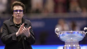 Billie Jean King applauds next to trophy during the Billie Jean King Cup finals in La Cartuja stadium in Seville, southern Spain, Sunday, Nov. 12, 2023. (Manu Fernandez/ dpa via AP)