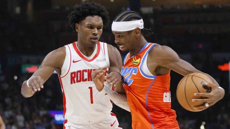 Oklahoma City Thunder guard Shai Gilgeous-Alexander, right, drives against Houston Rockets forward Amen Thompson (1) during the first half of an NBA basketball game Friday, Nov. 8, 2024, in Oklahoma City. (Nate Billings/AP)