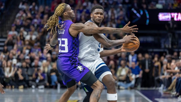 Minnesota Timberwolves guard Anthony Edwards (5) dribbles the ball up court as Sacramento Kings guard Keon Ellis (23) defends during the second half of an Emirates NBA Cup basketball game Friday, Nov. 15, 2024, in Sacramento, Calif. (Sara Nevis/AP)