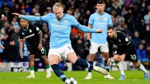 Manchester City's Erling Haaland scores the opening goal from the penalty spot during the Champions League opening phase soccer match between Manchester City and Feyenoord at the Etihad Stadium in Manchester, England, Tuesday, Nov. 26, 2024. (Potts/PA via AP)