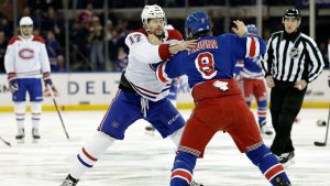 New York Rangers defenceman Jacob Trouba (8) fights Montreal Canadiens right wing Josh Anderson (17) in the first period of an NHL hockey game Saturday, Nov. 30, 2024, in New York. (Adam Hunger/AP Photo)