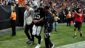 Las Vegas Raiders quarterback Gardner Minshew (15) is helped off the field after an injury against he Denver Broncos during the second half of an NFL game, Sunday, Nov. 24, 2024, in Las Vegas. (AP/Rick Scuteri)