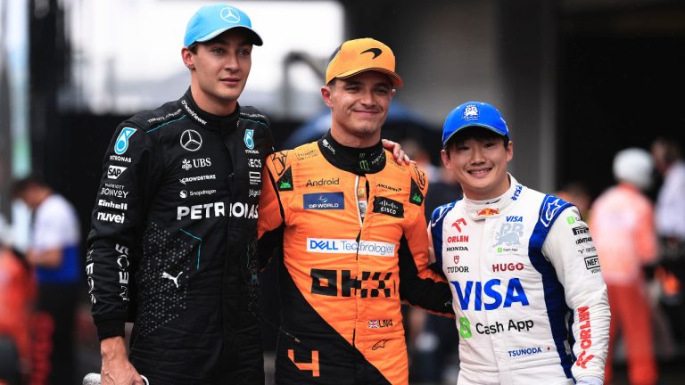 First-place finisher McLaren driver Lando Norris of Britain, centre, poses for a photo with second-place finisher Mercedes driver George Russell of Britain, left, and third-place finisher RB driver Yuki Tsunoda of Japan at the end of the qualifying session ahead to the Brazilian Formula One Grand Prix at the Interlagos race track, in Sao Paulo, Brazil, Sunday, Nov. 3, 2024. (Ettore Chiereguini/AP)