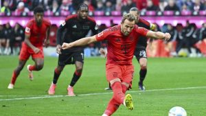 Bayern's Harry Kane shoots to score from the penalty spot during the Bundesliga soccer match between Bayern Munich and Union Berlin at the Allianz Arena. (Sven Hoppe/AP)
