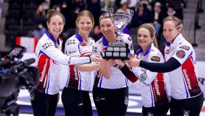 Rachel Brown, Sarah Wilkes, Emma Miskew, Tracy Fleury and Rachel Homan celebrate with the Co-op Canadian Open trophy on Sunday, Nov. 10, 2024, in Nisku, Alta. (Anil Mungal/GSOC)