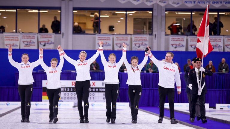 Rachel Homan, Tracy Fleury, Emma Miskew, Sarah Wilkes, Rachel Brown and coach Viktor Kjell celebrate after winning gold at the Pan Continental Curling Championships on Saturday, Nov. 2, 2024, in Lacombe, Alta. (Anil Mungal/GSOC)