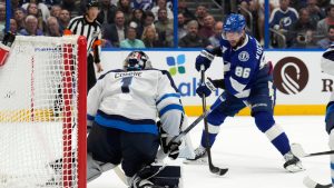 Tampa Bay Lightning right wing Nikita Kucherov (86) shoots on Winnipeg Jets goaltender Eric Comrie (1) during the second period of an NHL hockey game Thursday, Nov. 14, 2024, in Tampa, Fla. (Chris O'Meara/AP)