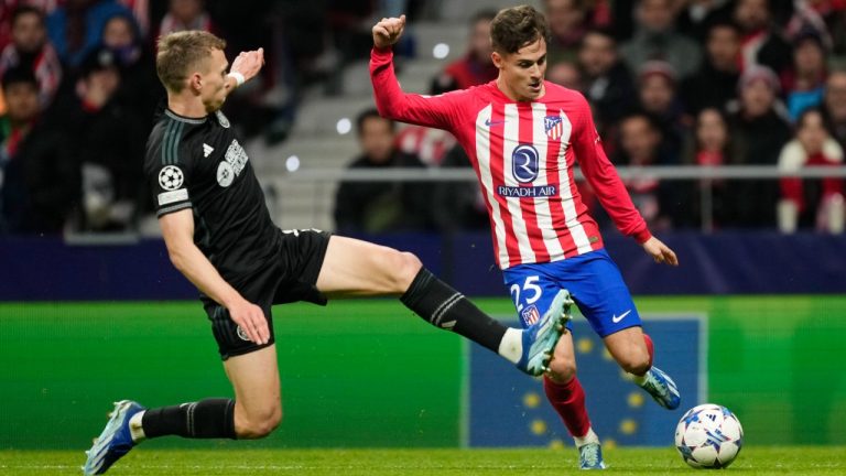 Celtic's Alistair Johnston, left, in action against Atletico Madrid's Rodrigo Riquelme during the Champions League Group E soccer match between Atletico Madrid and Celtic at the Metropolitano stadium in Madrid, Spain, Tuesday, Nov. 7, 2023. (Jose Breton/AP)