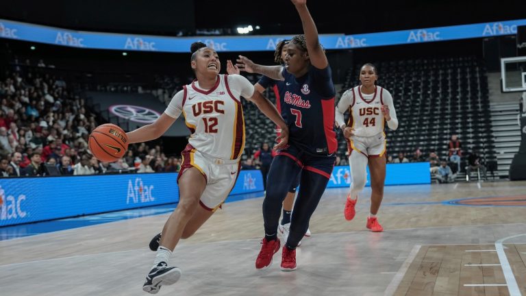 USC Trojans guard Juju Watkins, left, scored a team-high 27 points on Monday. (Aurelien Morissard/AP Photo)