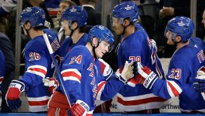 New York Rangers right wing Kaapo Kakko (24) celebrates with teammates after scoring a goal in the third period of an NHL hockey game against the Montreal Canadiens Saturday, Nov. 30, 2024, in New York. The Rangers won 4-3. (Adam Hunger/AP Photo)