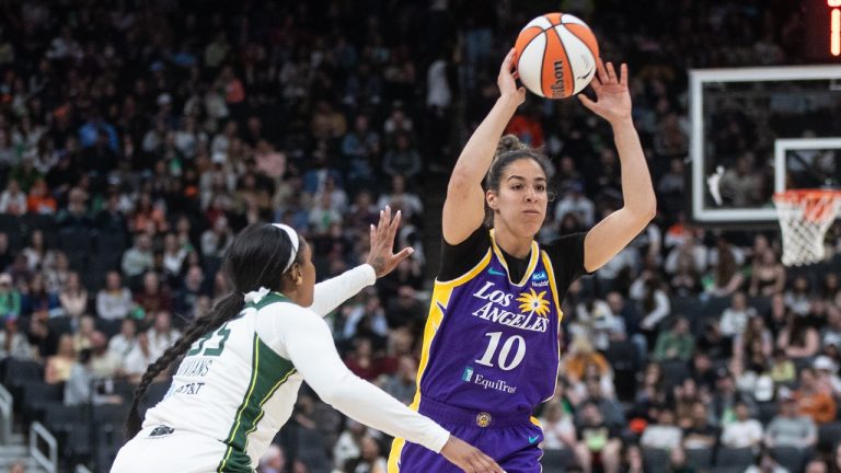 Los Angeles Sparks' Kia Nurse (10) makes the pass as Seattle Storm's Victoria Vivians (35) tries to block during second half WNBA preseason action in Edmonton on Saturday, May 4, 2024. A new study shows that more Canadian girls are participating in organized sports, but they are still lagging behind boys. (Jason Franson/CP)