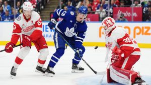 Detroit Red Wings' goaltender Cam Talbot (39) makes a save as Moritz Seider (53) and Toronto Maple Leafs' Matthew Knies (23) look on during second period NHL hockey action in Toronto on Friday, November 8, 2024. (Frank Gunn/CP)