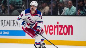 New York Rangers left wing Chris Kreider (20) moves the puck against the Seattle Kraken during an NHL hockey game Sunday, Nov. 17, 2024, in Seattle. (Lindsey Wasson/AP)