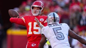 Kansas City Chiefs quarterback Patrick Mahomes (15) throws over Las Vegas Raiders linebacker Divine Deablo (5) during the first half of an NFL football game in Kansas City, Mo., Friday, Nov. 29, 2024. (Charlie Riedel/AP)