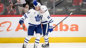 Toronto Maple Leafs centre John Tavares (91) celebrates his game winning goal with right wing Mitch Marner (16) during overtime of an NHL hockey game against the Washington Capitals, Wednesday, Nov. 13, 2024, in Washington. The Maple Leafs won 4-3 in overtime. (Nick Wass/AP)