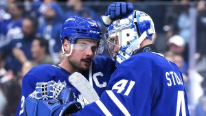 Toronto Maple Leafs' Auston Matthews, left, congratulates goaltender Anthony Stolarz after their team's victory over the Pittsburgh Penguins in NHL hockey action in Toronto, on Saturday, October 12, 2024. (Chris Young/CP)