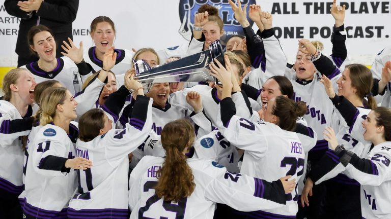 Minnesota players celebrate with the Walter Cup after defeating Boston to win the PWHL Walter Cup, May 29, 2024, in Lowell, Mass. (Mary Schwalm/AP)