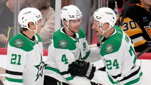 Dallas Stars' Miro Heiskanen (4) celebrates with Jason Robertson (21) and Roope Hintz (24) after scoring his second goal in the first period of an NHL hockey game against the Pittsburgh Penguins in Pittsburgh, Monday, Nov. 11, 2024. (Gene J. Puskar/AP)