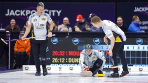 Bruce Mouat (centre) shoots a stone during the Kioti National on Nov., 28, 2024, in St. John's, N.L. (Anil Mungal/GSOC)