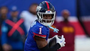 New York Giants wide receiver Malik Nabers (1) makes a catch against the Washington Commanders during the second half of an NFL football game. (Seth Wenig/AP)