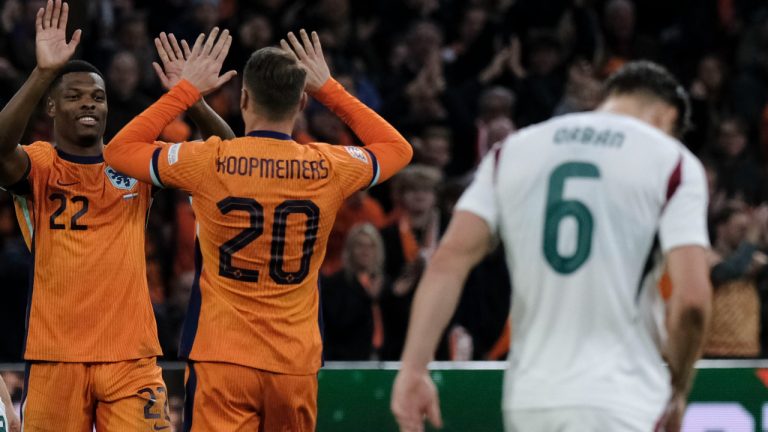 Teun Koopmeiners of the Netherlands, centre, celebrates with Denzel Dumfries of the Netherlands after scoring his side's fourth goal during the UEFA Nations League soccer match between Netherlands and Hungary, at the Johan Cruyff Arena, in Amsterdam, Netherlands, Saturday, Nov. 16, 2024. (Patrick Post/AP)