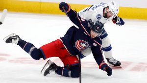 Columbus Blue Jackets forward Cole Sillinger, bottom, collides with Tampa Bay Lightning forward Nikita Kucherov, top, during the third period of an NHL hockey game in Columbus, Ohio, Thursday, Nov. 21, 2024. (Paul Vernon/AP)