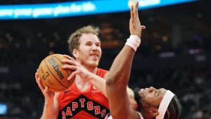 Toronto Raptors centre Jakob Poeltl (19) drives at Philadelphia 76ers forward Guerschon Yabusele (28) during first half NBA basketball action in Toronto on Friday, October 25, 2024. (Frank Gunn/CP Photo)