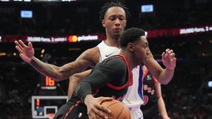 Toronto Raptors' RJ Barrett drives past Detroit Pistons' forward Ronald Holland II during first half NBA Cup basketball action in Toronto on Friday, November 15, 2024. (Chris Young/CP)