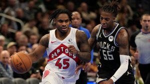 Toronto Raptors' Davion Mitchell tries to get past Milwaukee Bucks' Delon Wright during the second half of an Emirates NBA Cup tournament basketball game Tuesday, Nov. 12, 2024, in Milwaukee. (Morry Gash/AP Photo)