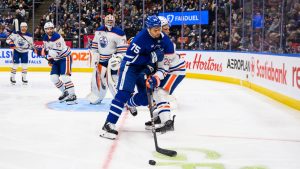 Toronto Maple Leafs right wing Ryan Reaves (75) collides with Edmonton Oilers defenceman Darnell Nurse (25) during second period NHL hockey action, in Toronto, Saturday, Nov. 16, 2024. (Christopher Katsarov/CP)