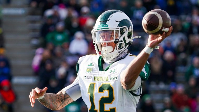 University of Regina Rams quarterback Trey Jones (12) throws against the University of Saskatchewan Huskies during the second half of the U Sports Canada West Hardy Cup football championship action in Saskatoon, Sask., on Saturday, November 9, 2024. (Heywood Yu/THE CANADIAN PRESS)