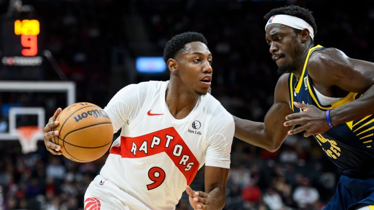 Toronto Raptors guard RJ Barrett (9) advances under pressure from Indiana Pacers forward Pascal Siakam (43) during first half NBA basketball action in Toronto, Monday, Nov. 18, 2024. (Christopher Katsarov/CP)