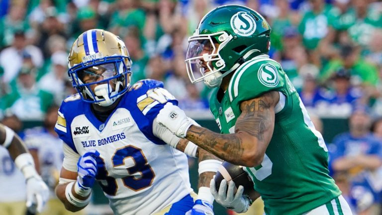 Saskatchewan Roughriders receiver Kian Schaffer-Baker (89) runs the football as Winnipeg Blue Bombers linebacker Tony Jones (33) looks on during the second half of CFL football action in Regina, on Sunday, September 1, 2024. (Heywood Yu/THE CANADIAN PRESS)