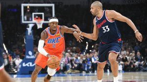 Oklahoma City Thunder guard Shai Gilgeous-Alexander (2) drives past Los Angeles Clippers forward Kawhi Leonard (33) during the first half of an NBA basketball game, Monday, Nov. 11, 2024, in Oklahoma City. (Kyle Phillips/AP)