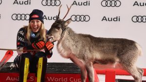 The winner United States' Mikaela Shiffrin shares the podium with a baby reindeer after an alpine ski, women's World Cup slalom, in Levi, Finland, Saturday, Nov. 16, 2024. (Marco Trovati/AP)