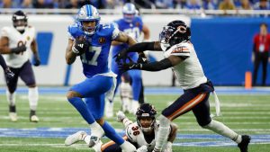 Detroit Lions wide receiver Tim Patrick (17) runs the ball against the Chicago Bears in the first half of an NFL football game in Detroit, Thursday, Nov. 28, 2024. (Rick Osentoski/AP)