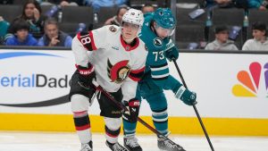 Ottawa Senators centre Tim Stützle (18) looks to pass the puck in front of San Jose Sharks centre Tyler Toffoli (73) during the second period of an NHL hockey game in San Jose, Calif., Wednesday, Nov. 27, 2024. (Jeff Chiu/AP)