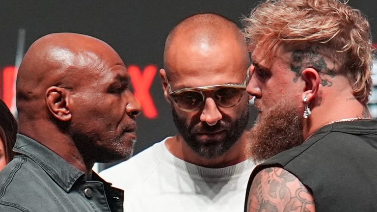 Mike Tyson, front left, and Jake Paul, front right, face off during a news conference ahead of their fight, Wednesday, Nov. 13, 2024, in Irving, Texas. (Julio Cortez/AP Photo)