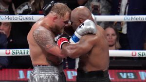 Jake Paul and Mike Tyson embrace after their heavyweight boxing match, Friday, Nov. 15, 2024, in Arlington, Texas. (AP Photo/Julio Cortez)