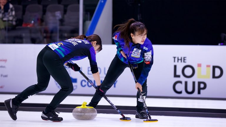 Team Fujisawa's Yurika Yoshida (left) and Chinami Yoshida (right) sweep a stone during the Co-op Canadian Open on Wednesday, Nov. 6, 2024, in Nisku, Alta. (Anil Mungal/GSOC)