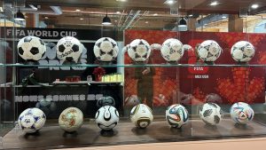 The entrance to FIFA’s World Cup 2026 office in Toronto with a display of match balls from FIFA World Cups dating back to the 1970 men’s tournament is shown on Monday Dec. 9, 2024. THE CANADIAN PRESS/Neil Davidson