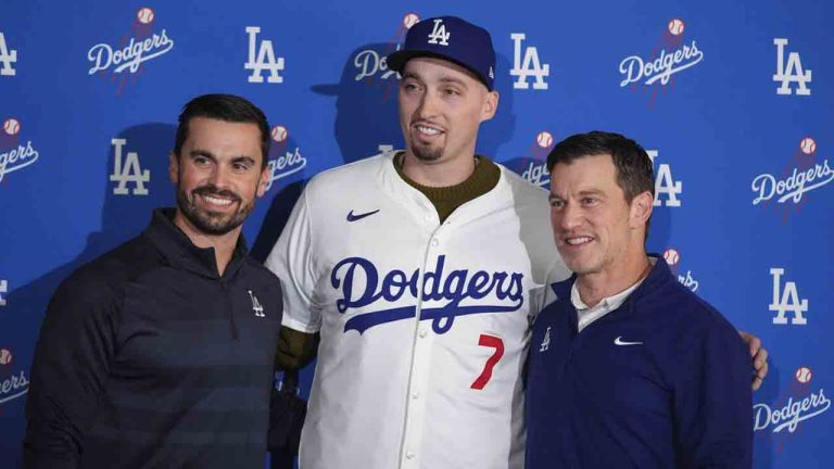 Los Angeles Dodgers pitcher Blake Snell, centre, poses for photos with president of baseball operations Andrew Friedman, right, and general manager Brandon Gomes during a news conference Tuesday, Dec. 3, 2024, in Los Angeles. (Jae C. Hong/AP)