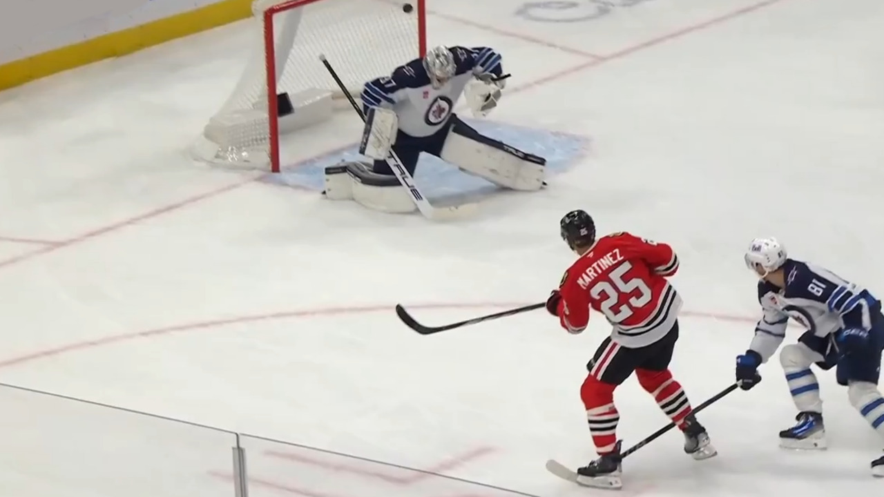 Martinez beats Hellebuyck with top-corner snipe for first as a Blackhawk