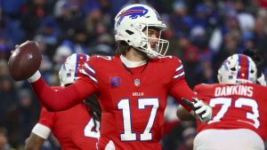 Buffalo Bills quarterback Josh Allen (17) passes against the New England Patriots during the first quarter of an NFL football game, Sunday, Dec. 22, 2024, in Orchard Park, N.Y. (Jeffrey T. Barnes/AP)