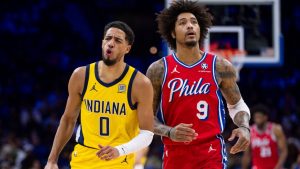 Indiana Pacers' Tyrese Haliburton, left, reacts to his basket as Philadelphia 76ers' Kelly Oubre Jr., right, looks on during the first half of an NBA basketball game, Friday, Dec. 13, 2024, in Philadelphia. (Chris Szagola/AP)